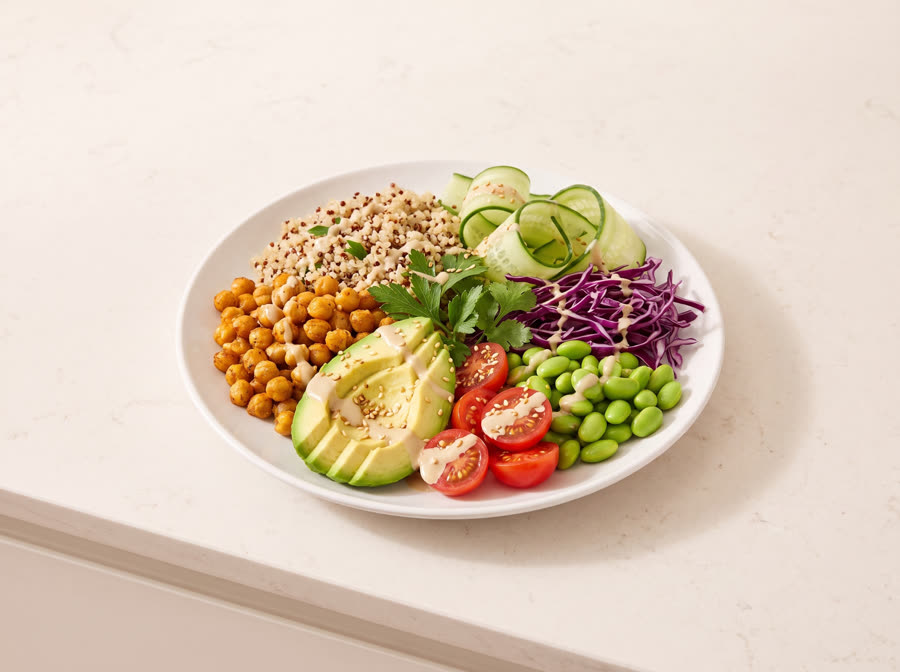 Vegan quinoa bowl with chickpeas, avocado and vegetables