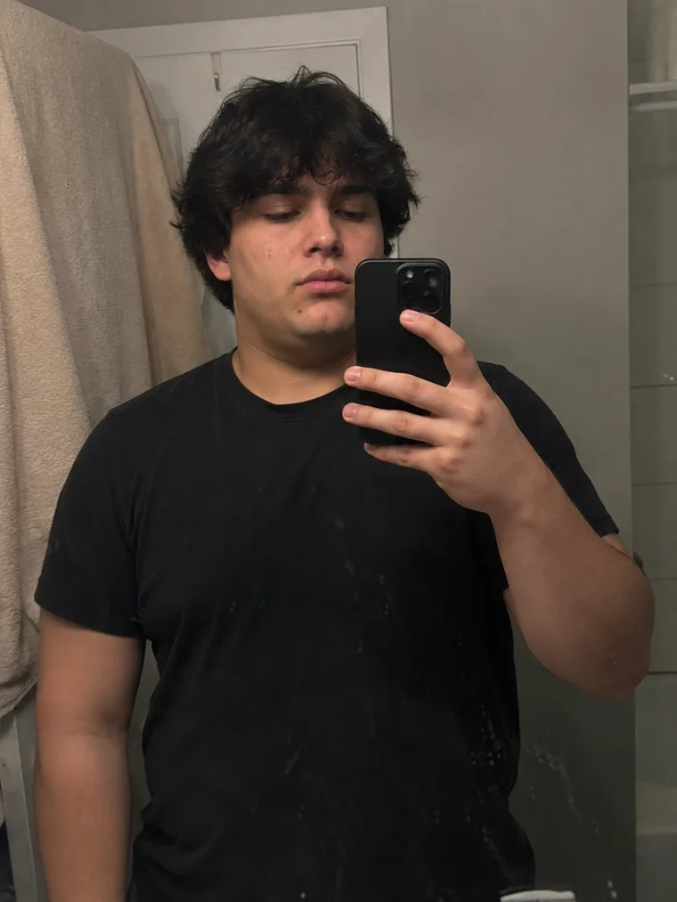 Bryan before following the meal program, mirror photo in black t-shirt